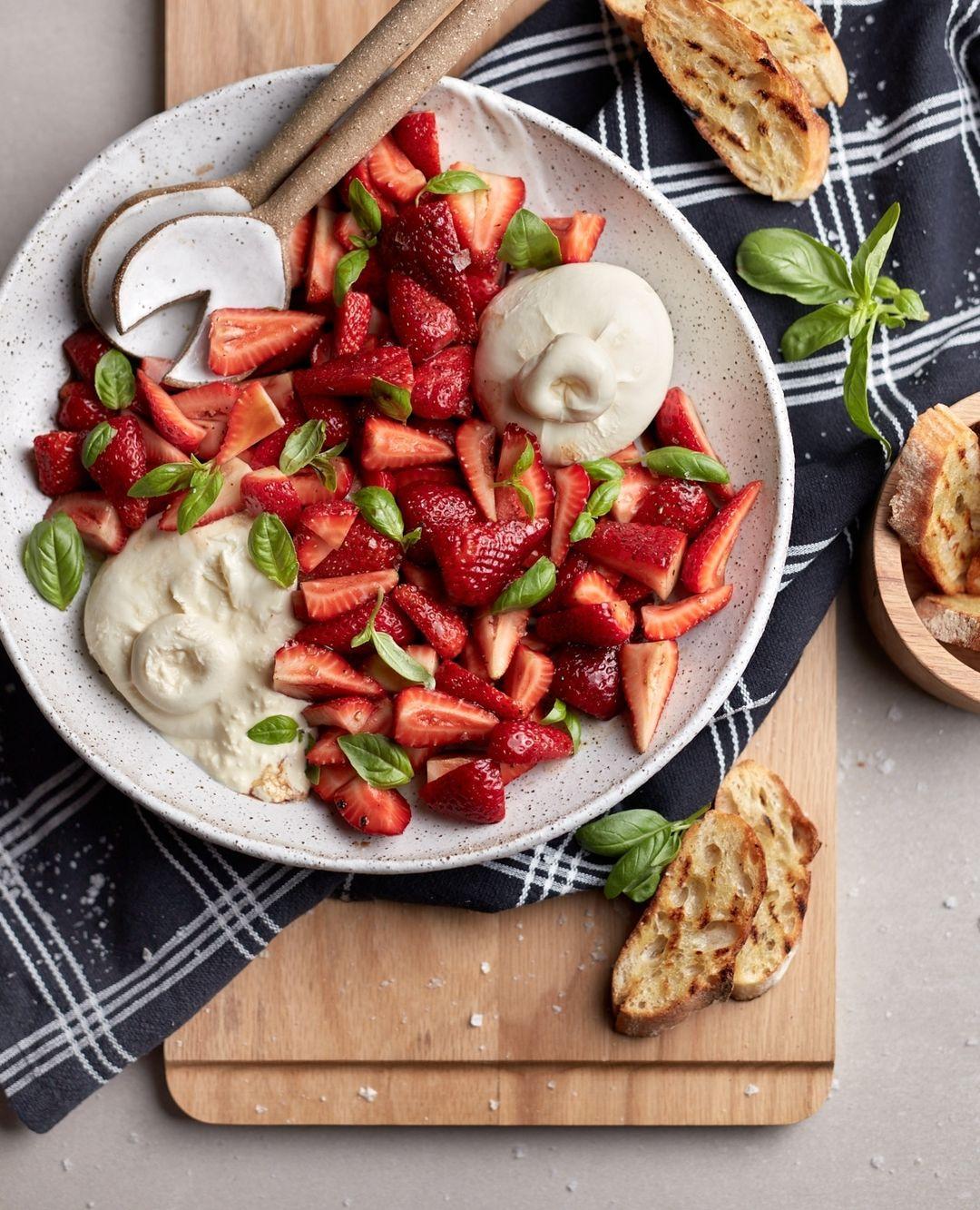 class="content__text"
 How good are strawberries at the moment!? 😍🍓⁠
Recipe I recently created for @vicstrawberries⁠
⁠
🍓 Strawberries with Burrata⁠
⁠
x2 250g punnet strawberries⁠
2 tbsp balsamic vinegar⁠
1 tbsp maple syrup⁠
freshly ground black pepper⁠
sea salt flakes⁠
2 x 100g burrata balls⁠
baby basil leaves, picked⁠
baguette slices, chargrilled, for serving⁠
extra virgin olive oil, for serving⁠
⁠
Hull and quarter the strawberries, and place into a large bowl. Mix through the balsamic vinegar, maple syrup and black pepper. ⁠
⁠
Place the burrata balls on a large platter, and spoon the strawberry mixture onto the platter. Drizzle over any extra juices, top with sea salt flakes, baby basil leaves and a drizzle of olive oil. ⁠ 
 