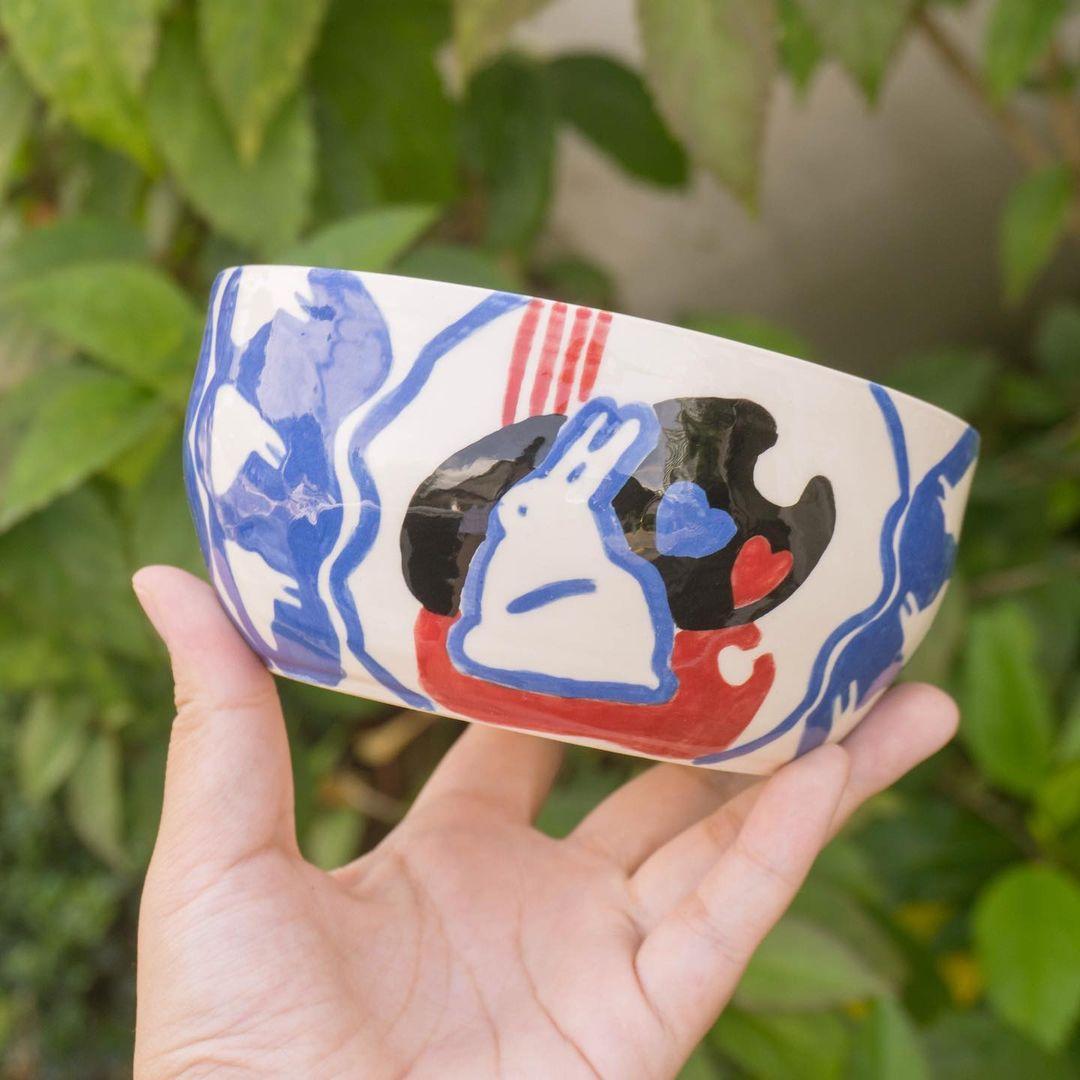 class="content__text"
 It’s the year of the rabbit!! 🐰 

I had so much fun painting this white rabbit bowl! It’s been a while since Iast painted this pattern so I wanted to give it a go with a different medium ✨ Any thoughts on this bowl for ramen or should we have it only as a candy bowl? 😅 Now available for pre-order!! 

Swipe right to see the white rabbit keychains from 3 years ago, made with polymer clay 🐇

 #pottery #pottersofinstagram 
 
