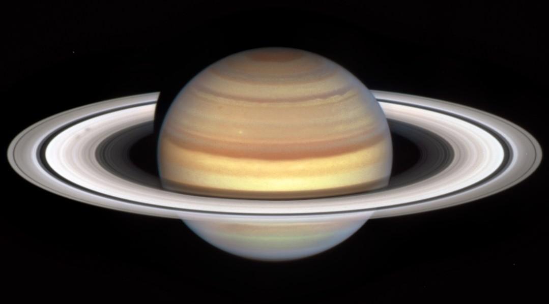 
 It's okay, Saturn! We're all a little strange sometimes. 

New @NASAHubble images show strange spokes that appear across Saturn's rings around the planet's equinoxes. They're likely caused by Saturn's magnetic field electrically charging tiny ice particles.

Image Description:
Hubble image of Saturn against a black backdrop. The planet is horizontally striped with browns, golds, oranges, and dark reds. Near the planet’s equator, the stripes are especially bright yellow. The planet is surrounded by rings, and the angle of the image shows them from above, so the divisions between different rings are stark. Nearest the planet, the rings are darker and almost transparent. Next out, gray rings move from darker to lighter as you move away from the planet. Then, a thin, very dark ring is surrounded by medium brown rings farthest out.

 #Saturn #Space #Planets #GasGiant #Hubble #Telescope #NASA 
 