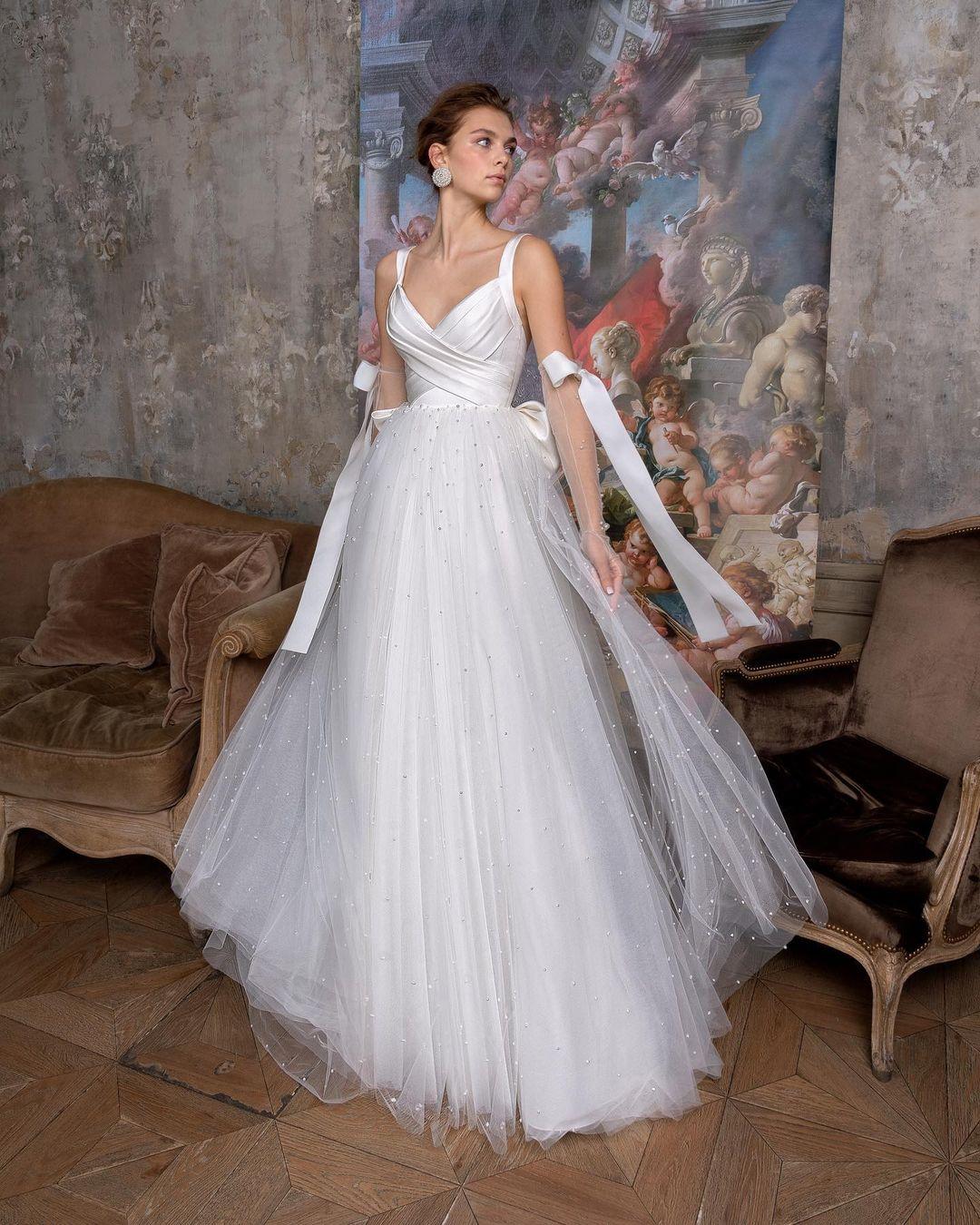 class="content__text"
 Selection of classic princess-silhouette wedding gowns from the collection “Perla Rosa” 
 