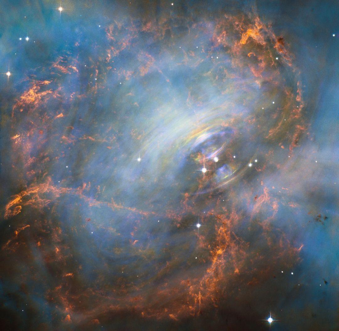 class="content__text"
 Did you know that the Crab Nebula’s pulsar is one of the earliest ever confirmed? These rapidly spinning neutron stars were first discovered by Jocelyn Bell Burnell in 1967. The Crab Nebula’s pulsar was found only a year later in 1968.

In the past, ground-based telescopes were exclusively used to detect pulses of light. Space-based telescopes like the Hubble Space Telescope, however, allow us to get a far closer look at pulsars. 

 #Hubble #pulsar #stars #CrabNebula

Credit: NASA and ESA; J. Hester (ASU) and M. Weisskopf (NASA/MSFC). 

ALT TEXT: A nebula. To the right of center in the image is bright blue gas that forms circular waves that extend outward from the center. In the midst of this bright blue gas are yellow wisps and red filaments that swirl around the bright blue center. White stars are spread throughout the image. 
 