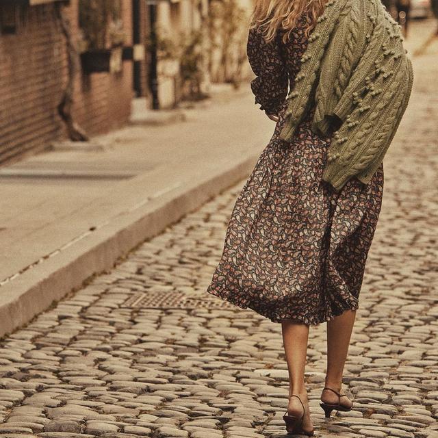 Winter Wanders 🕊 @heloise_guerin_demarchelier on a Saturday walk in the Cecily dress 🍒

~

Image Description // Heloise strolls down a cobbled road wearing a full-length, paisley dress, a strappy, kitten-heeled shoes, and a green, knitted cardigan draped behind one shoulder. Heloise self-identifies as a Caucasian woman.