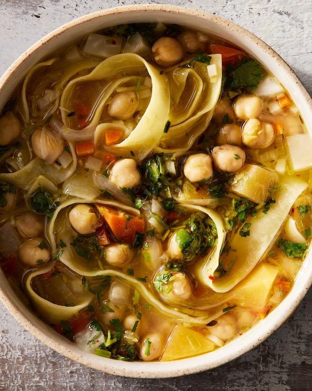 It's getting cold out there, friends! Warm-up with @abraberens chickpea noodle soup and all its veggies, hearty chickpeas, and pappardelle goodness. Recipe at the link in bio. 📸: @markweinbergnyc